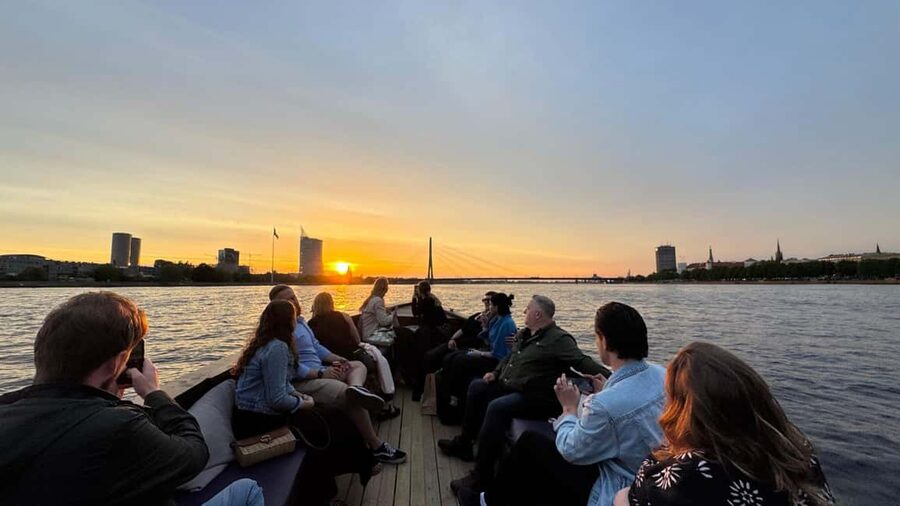 Riga: Canal Boat Tour with Welcome Drink & Audio Guide - How the audio guide and seating affect the experience