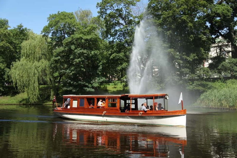 Riga: Canal & Daugava Cruise on a Historic Wooden Boat - Boarding beside the Freedom Monument