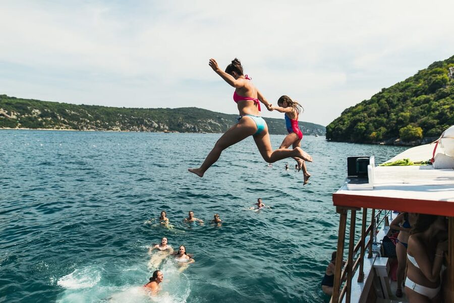 Rovinj: Sunset Cruise with Swim Stop, Drinks, and Fruits - Sunset views of Rovinj from the sea
