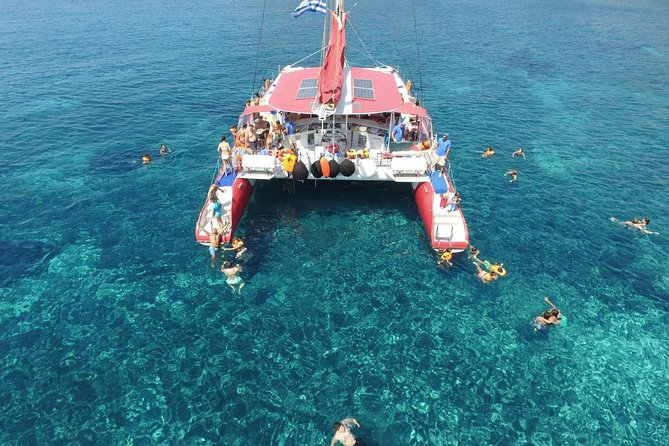 Sailing Catamaran Cruise in Santorini with BBQ, Drinks and Transfer - White Beach, swimming, and the barbecue lunch