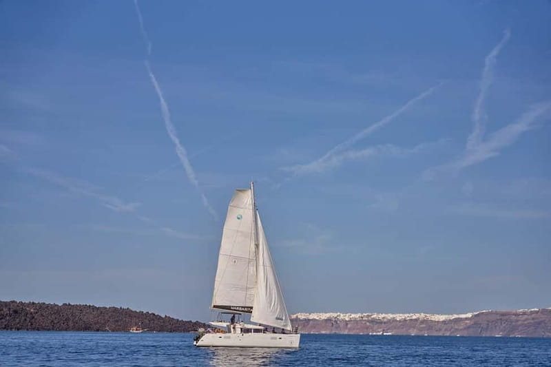 Santorini: Caldera Classic Catamaran Cruise w/ Meal & Drinks - Red Beach and the first swim