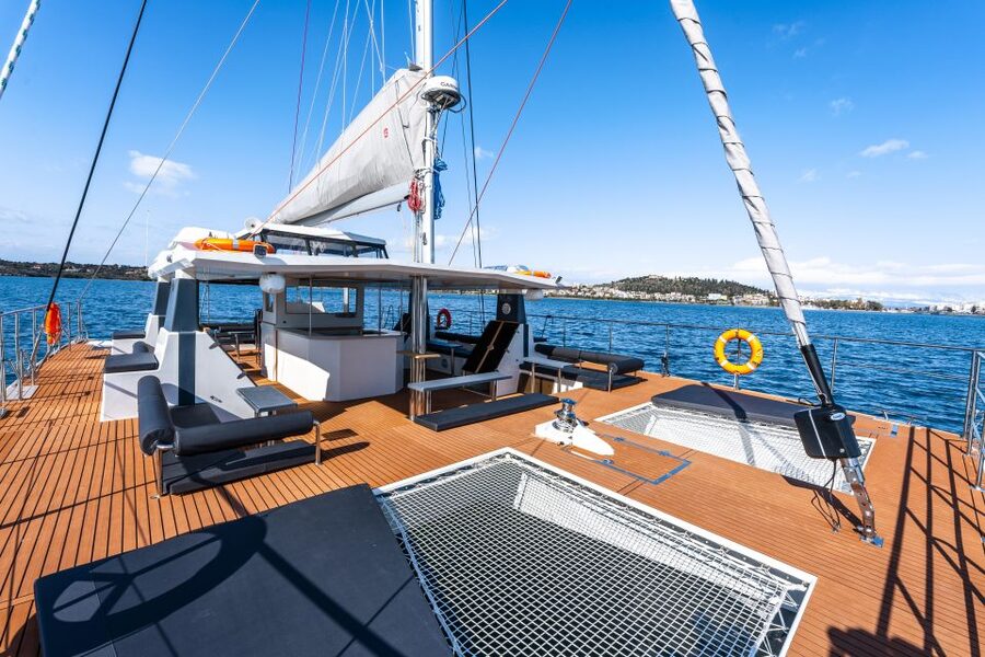 Santorini: Catamaran Caldera Cruise with Meal and Drinks - Crew service, music, and the overall mood