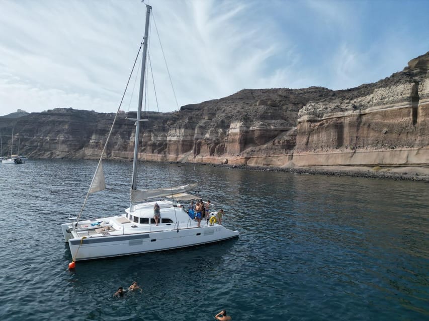 Santorini: Catamaran Cruise with Greek BBQ and Drinks - A Greek BBQ served at sea