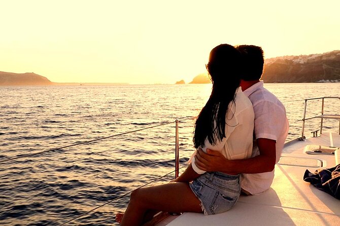 Santorini Catamaran Cruise with Greek Meal, Open-Bar and Sunset - Leaving shore with the caldera in view