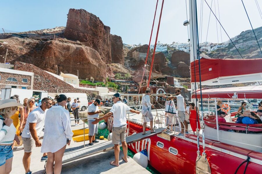 Santorini: Catamaran Tour with BBQ Dinner, Drinks, and Music - White Beach and the cliffs you can only see by sea