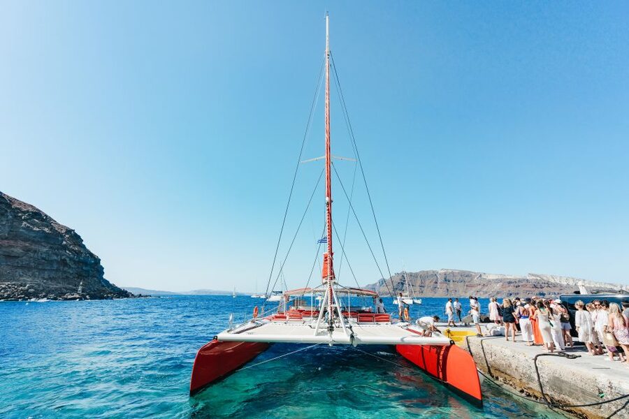 Santorini: Catamaran Tour with BBQ Dinner, Drinks, and Music - The Hot Springs: a warm volcanic start