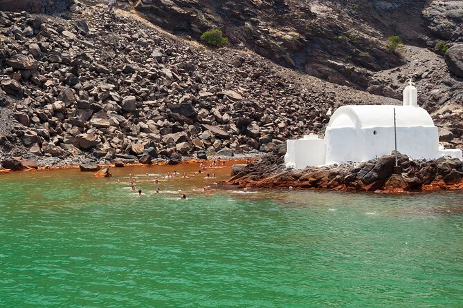 Santorini Classic Catamaran Cruise with BBQ, Drinks and Transfers - Indian Rocks, Caves, and the Caldera Edge