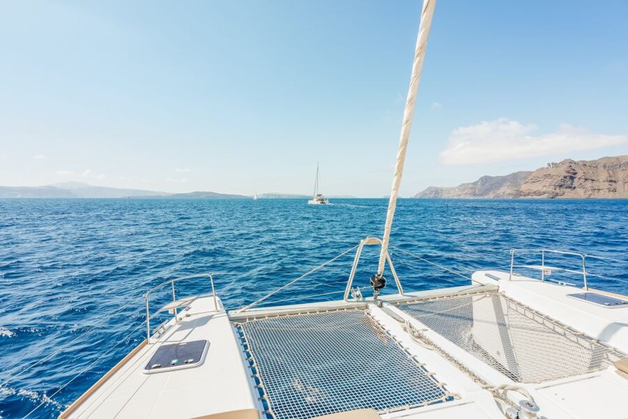 Santorini: Luxury Catamaran Day Trip with Meal and Open Bar - White Beach Sea Caves and Volcanic Coast