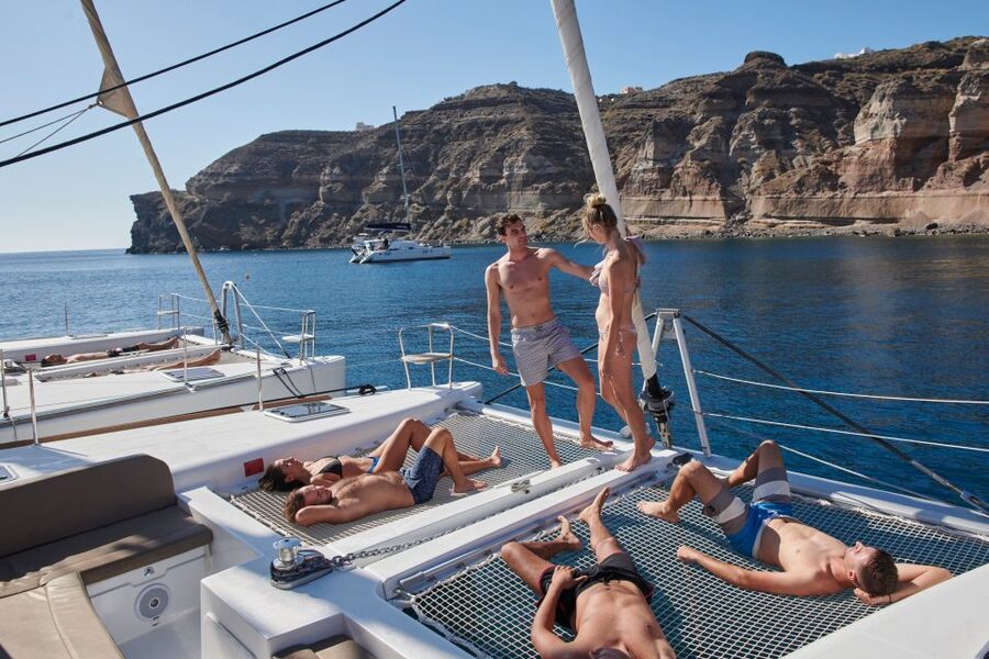 Santorini: Platinum Catamaran Cruise w/ BBQ Meal & Open Bar - The sunset from the water