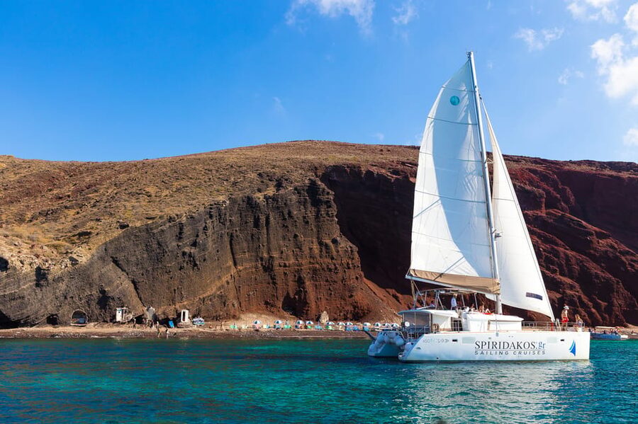 Santorini: Sailing Catamaran Cruise with BBQ and Drinks - Red Beach and White Beach from the water