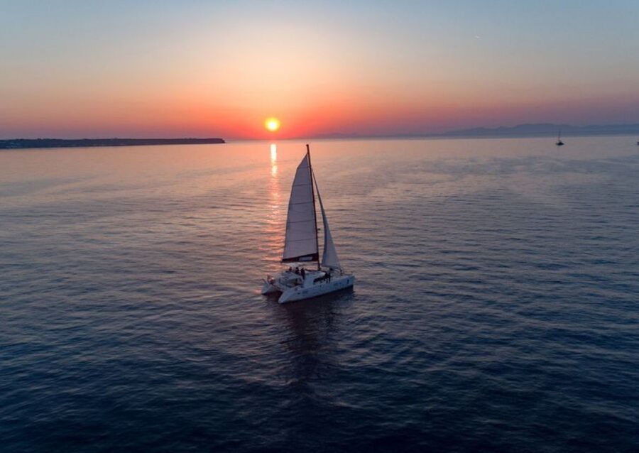 Santorini: Sunset Cruise with Swim Stops, Dinner, and Drinks - Swimming near the volcanic hot springs