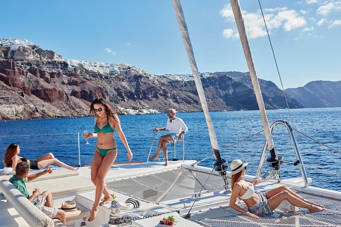 Santorini Sunset Luxury Sailing Catamaran Cruise with BBQ, drinks, transfer - Hotel pickup and the start at Vlychada
