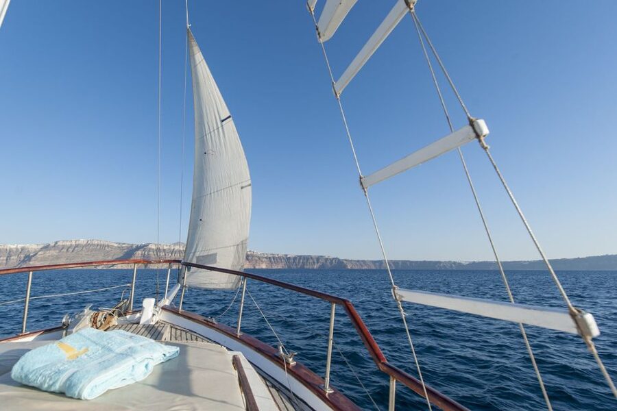 Santorini: Traditional Wooden Boat Tour with Meal and Wine - Black Mountain swimming and snorkeling