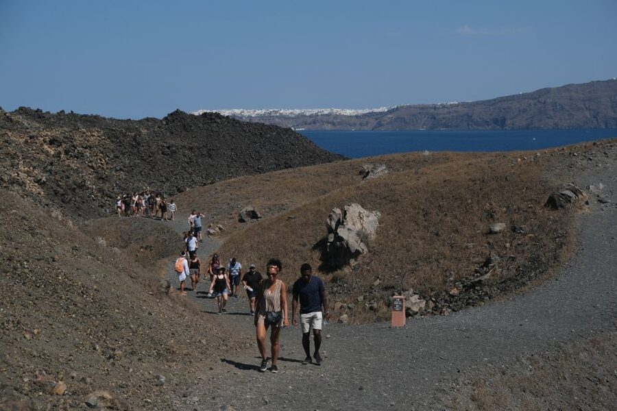Santorini: Volcano and Hot Springs Sunset Dinner Cruise - Nea Kameni gives the cruise its strongest sense of place